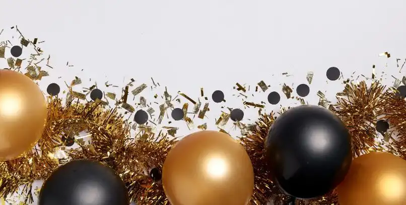 Black and gold ornaments with gold garland