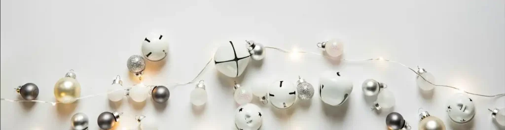 White ornaments and lights on white